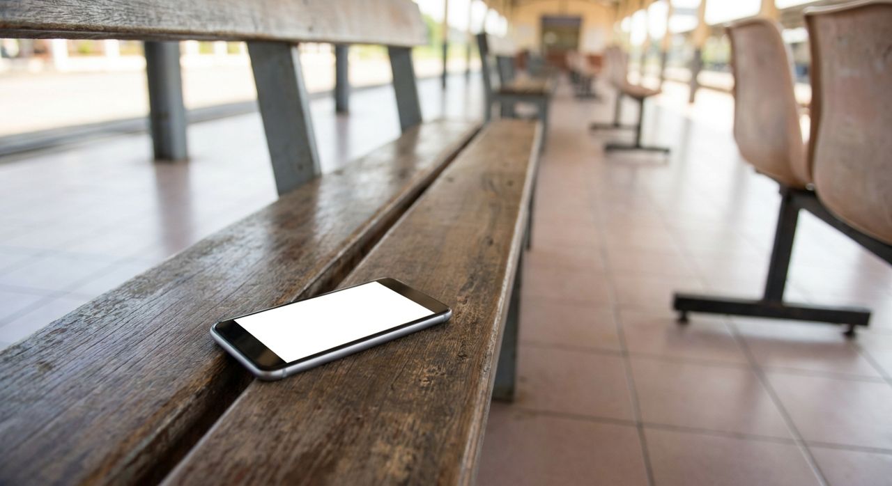 notify-passengers-bus-delay-phone-on-bench